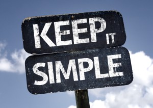 Keep It Simple sign with clouds and sky background